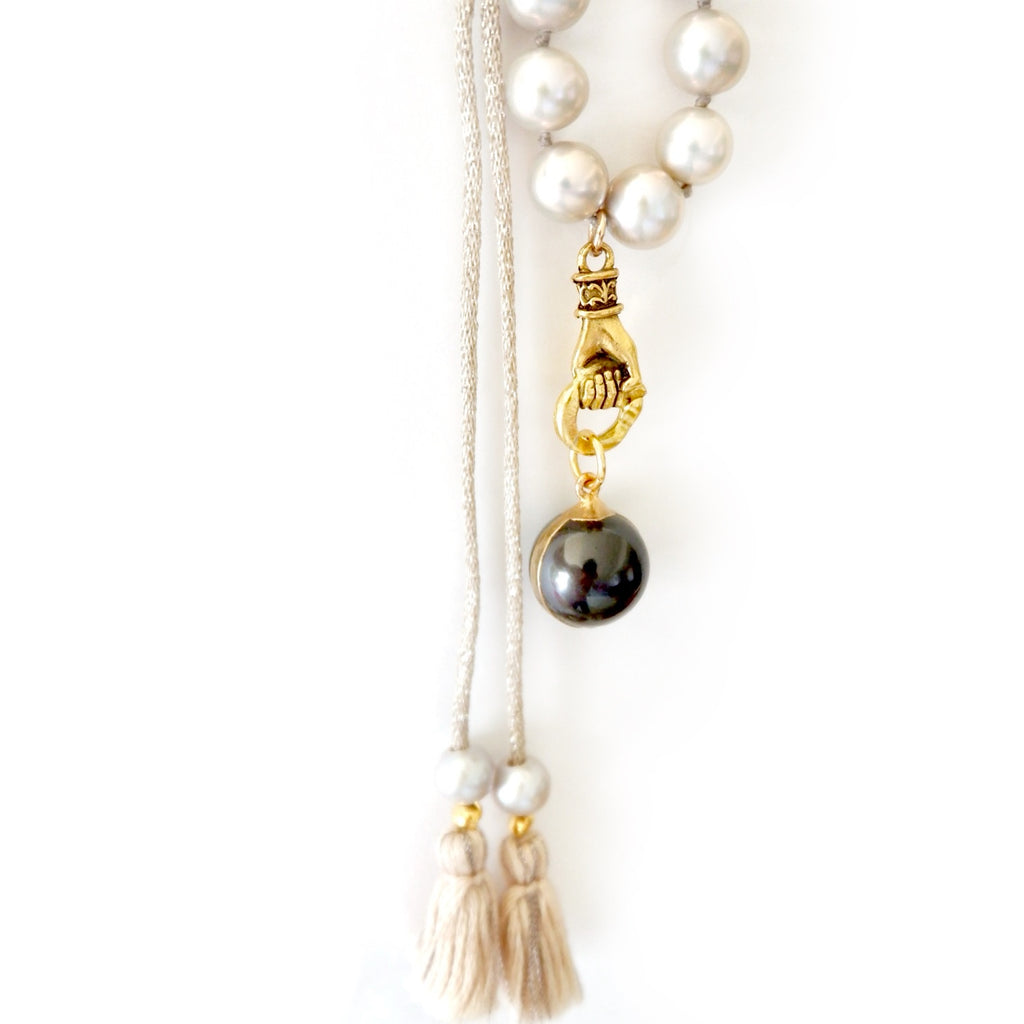 grey pearl in hand necklace