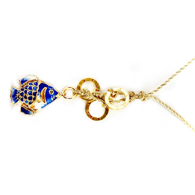 blue fish on a gold cord necklace