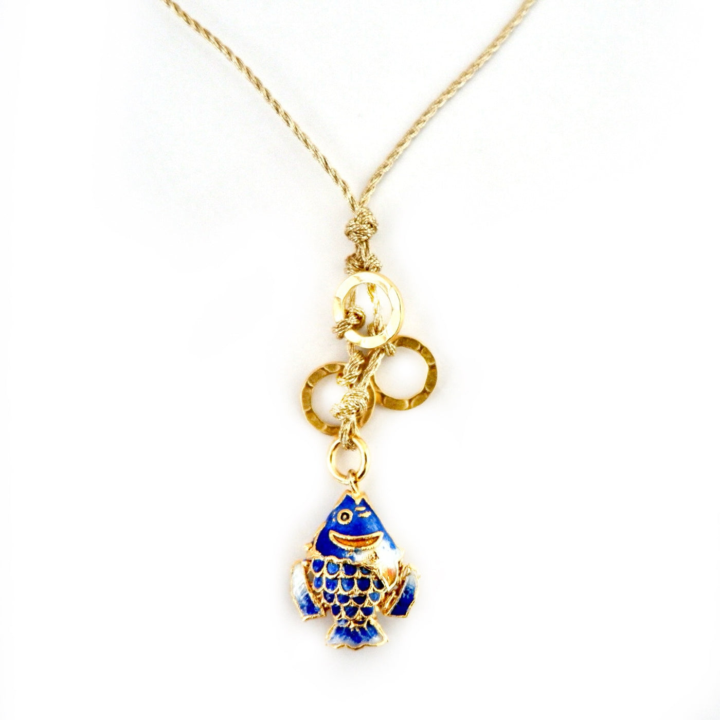 blue fish on a gold cord necklace