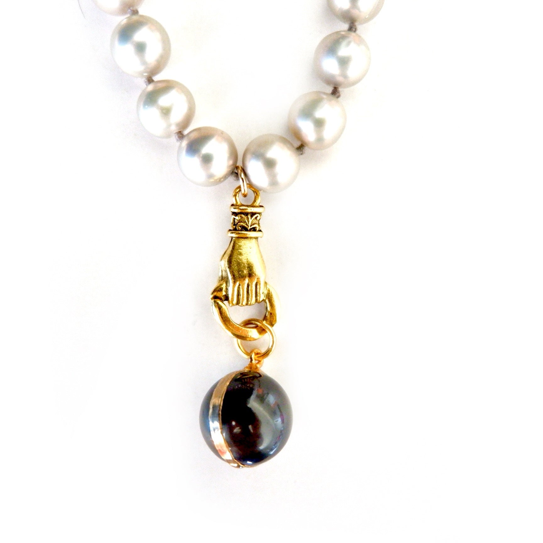 grey pearl in hand necklace