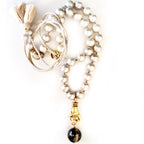 grey pearl in hand necklace