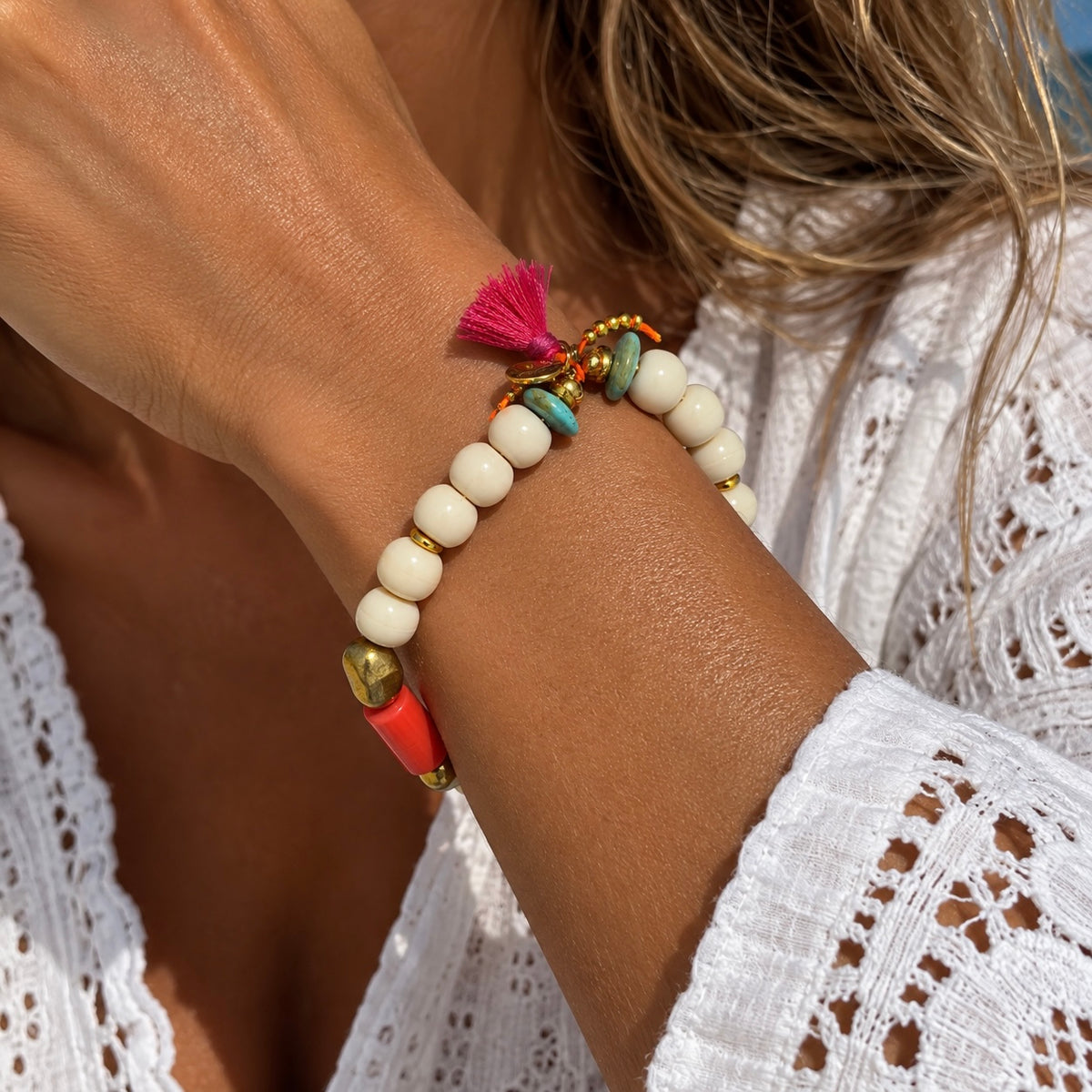 white pebbles and coral bracelet