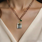 garnet and vintage locket necklace